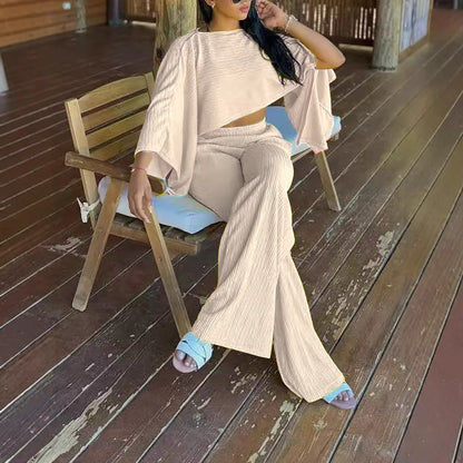 Solid-color Off-shoulder Top With An Asymmetrical Neckline, Paired With Elastic-waist Pants Featuring Pockets